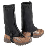 A pair of black HK-2001 gaiters over brown boots, designed for cross-country skiing and walking.