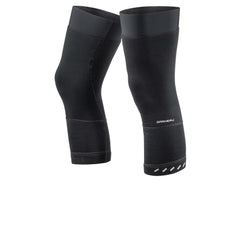 A pair of black knee warmers with a textured windbreaking fabric and reflective elements on the lower leg.